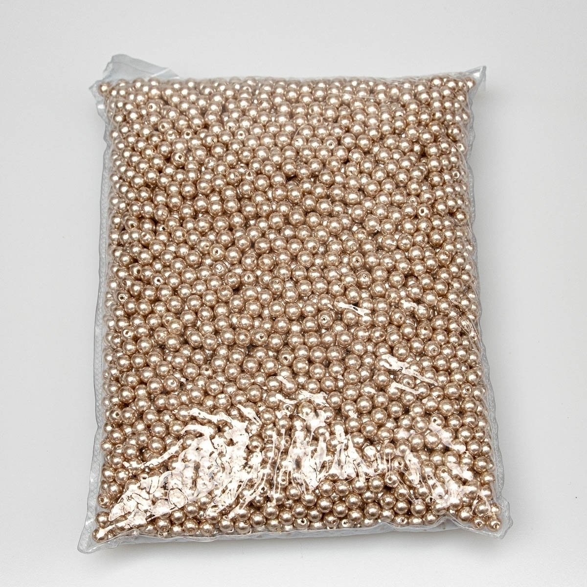 Dekorační korálky plastové, voskové, jednobarevné tmavě béžové (zlaté), průměr 6mm, balení 500g / 4500 ks