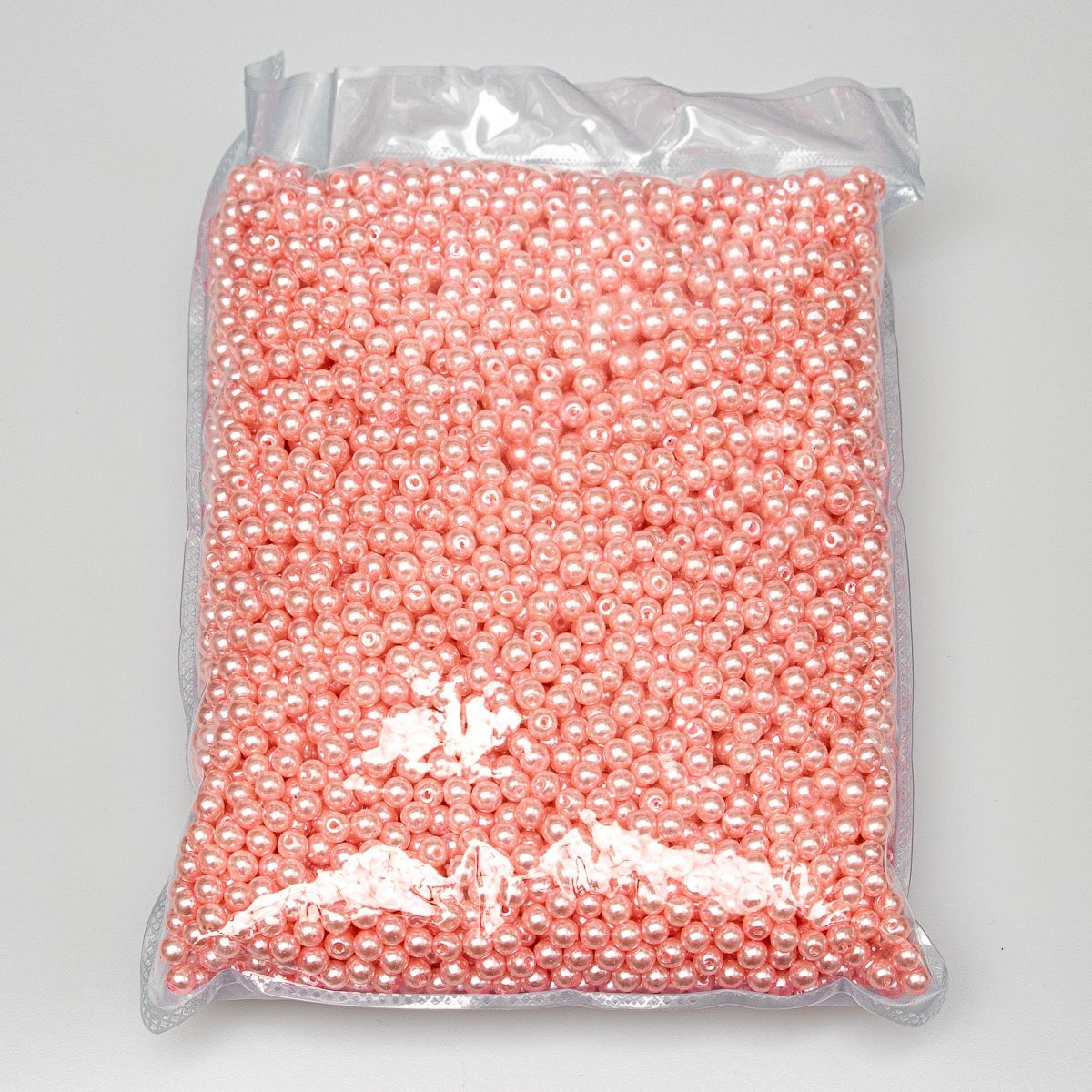 Dekorační korálky plastové, voskové, jednobarevné světle růžové, průměr 6mm, balení 500g / 4500 ks