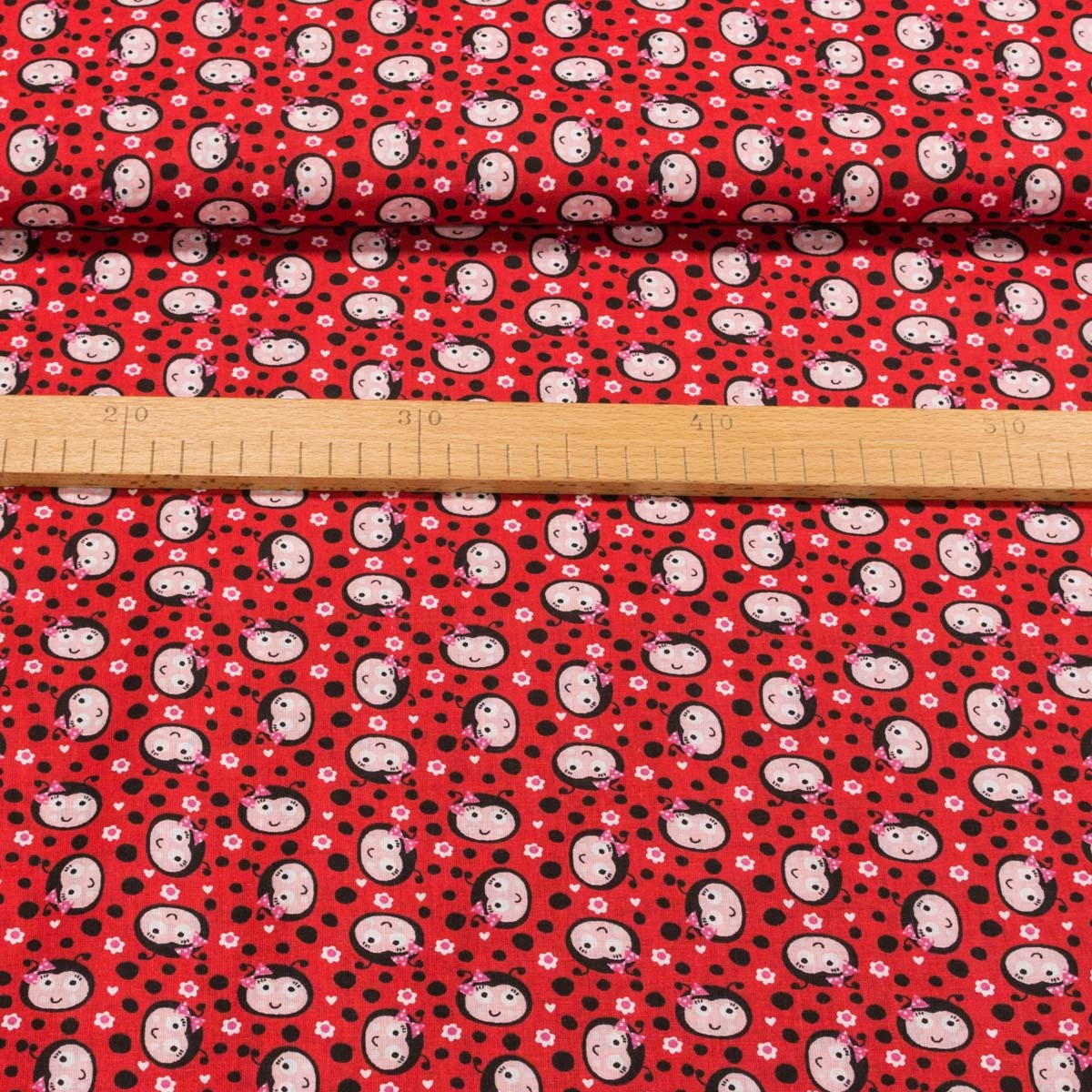 Bavlněné plátno dětské LGB 738001, hlavičky berušek na červené s puntíky, š.150cm (látka v metráži)