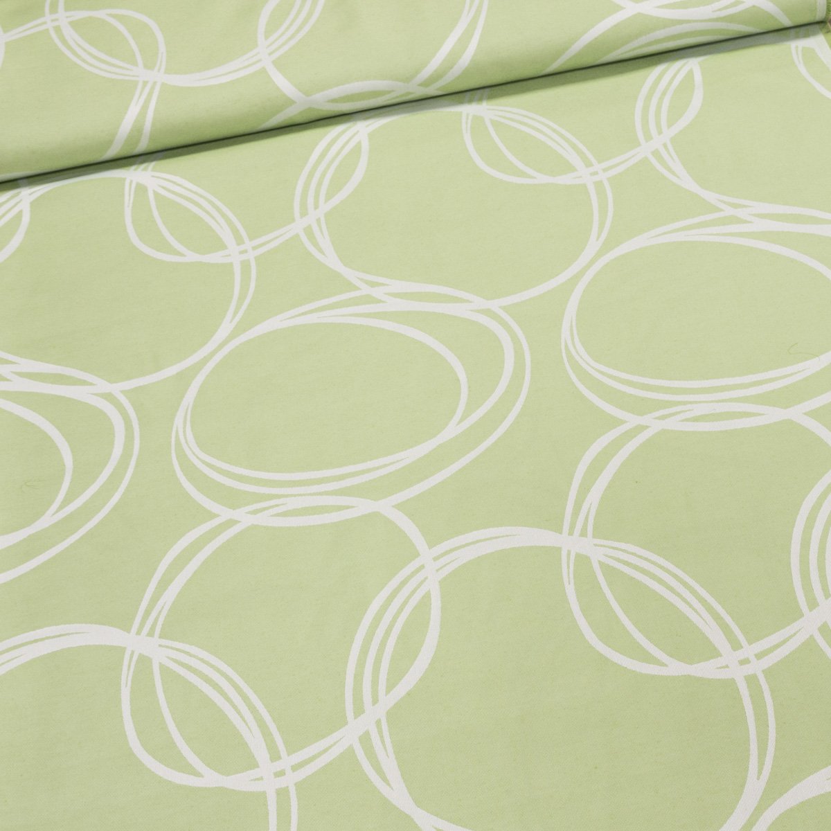 Dekorační závěs, krémové kruhy na zelené, šířka 140cm (látka v metráži)