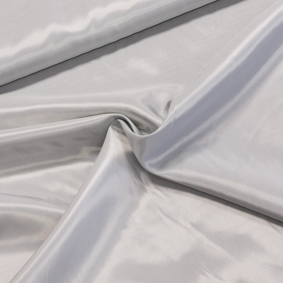 Podšívka polyesterová světle šedá, š.150cm (látka v metráži)