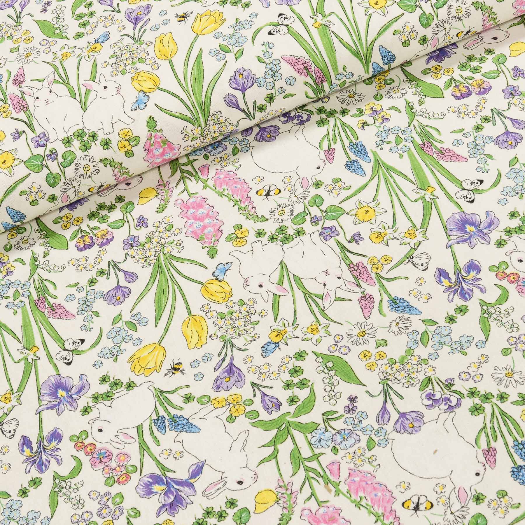 Směsové plátno  102530.1254.655, králíci v jarních květinách, zelená š.140cm (látka v metráži)